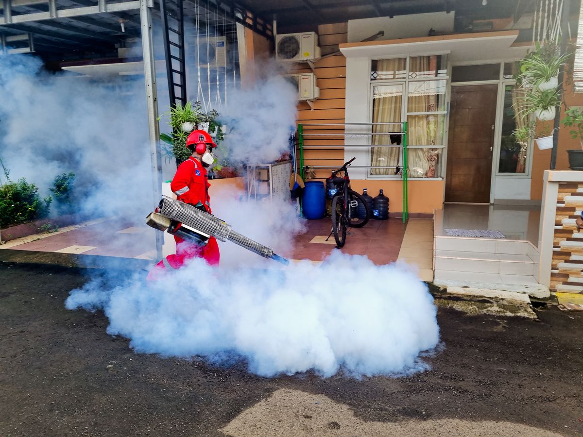 Licensed technician treating a home for pests